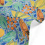 A detail of a fabric with a pattern depicting orange birds and green leaves on a blue background. 